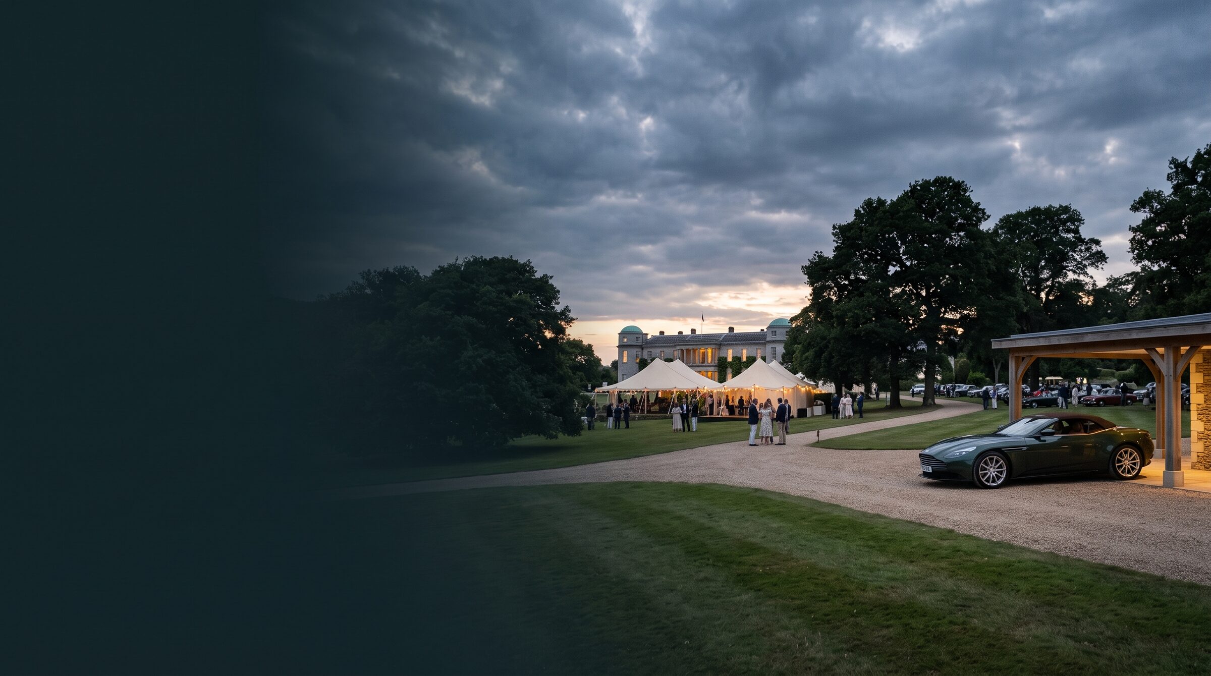 A grand tourer waiting at an English country estate on a summer evening