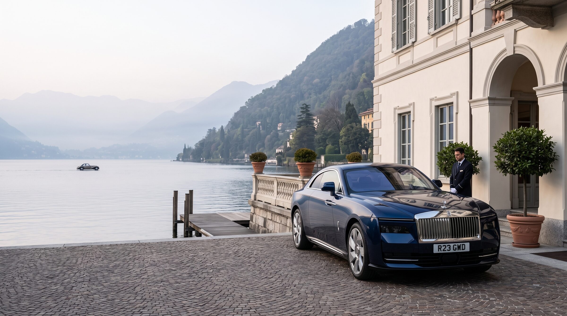 A midnight-blue grand tourer prepared outside a private lakeside property on Lake Como